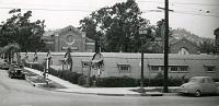 domed huts on a college lawn