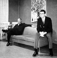 two men sitting on couch