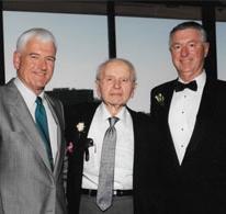 three men wearing suits